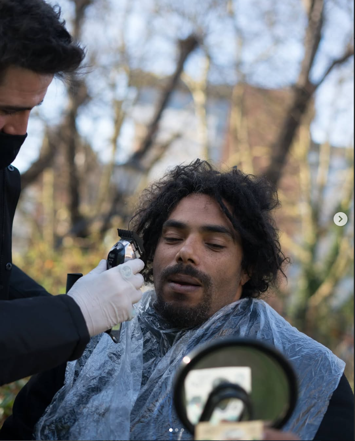 Eddie Ilic cutting a client's hair at a street pop-up in Bath